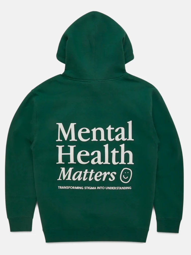 Back view of a dark green mental health matters hoodie featuring white block text and a small smiley face graphic.