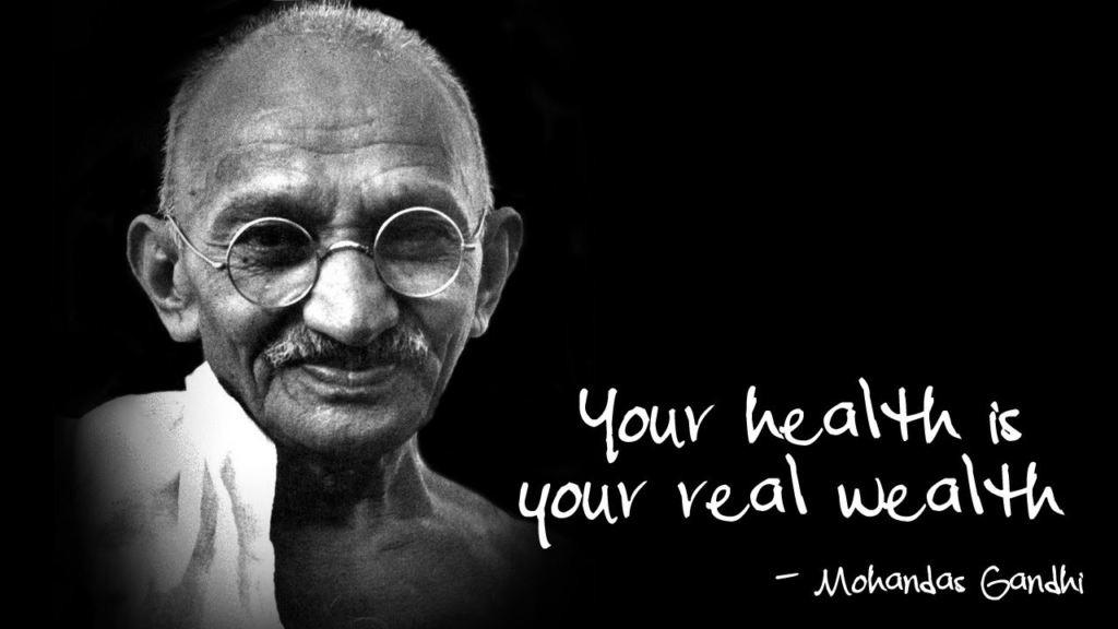 Portrait of Mahatma Gandhi with the inspirational quote, "Your health is your real wealth," emphasizing the importance of good health over material wealth.