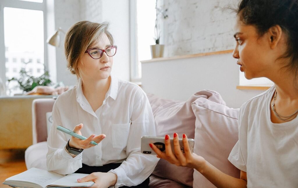 Behavioral health professional discussing mental health concerns with a client during a counseling session.
